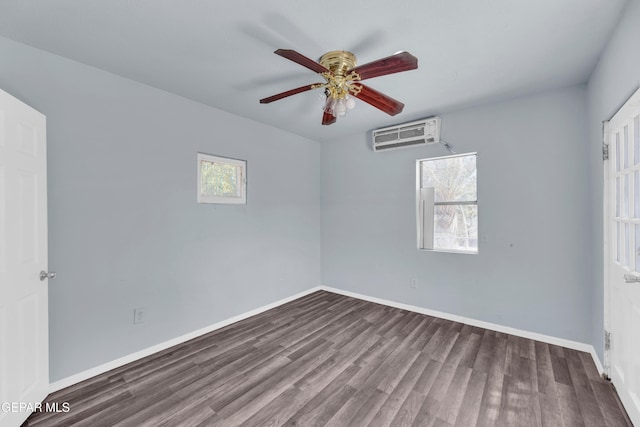 4301 Hueco Ave, El Paso, TX 79903 - unfurnished bedroom with dark wood-style floors, baseboards, a wall mounted air conditioner, and ceiling fan