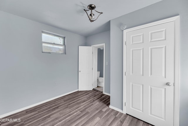 4301 Hueco Ave, El Paso, TX 79903 - unfurnished bedroom featuring baseboards and wood finished floors