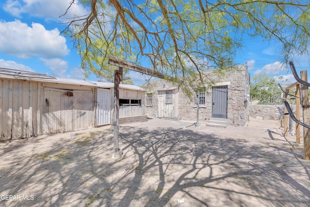 4301 Hueco Ave, El Paso, TX 79903 - rear view of house featuring an outbuilding and fence