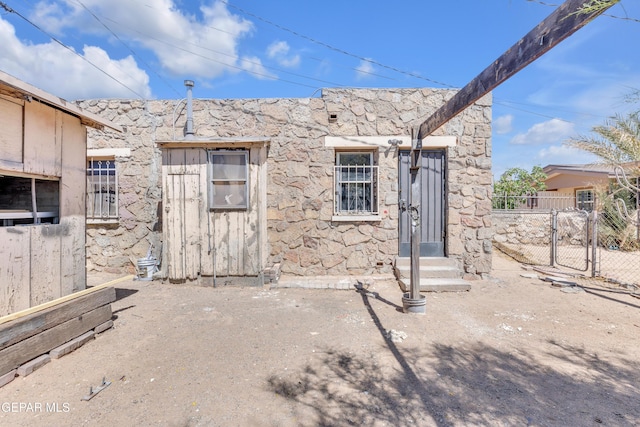 4301 Hueco Ave, El Paso, TX 79903 - entrance to property with a gate, fence, and stone siding