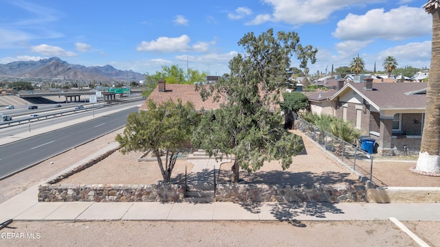 4301 Hueco Ave, El Paso, TX 79903 - view of front facade with a mountain view and fence