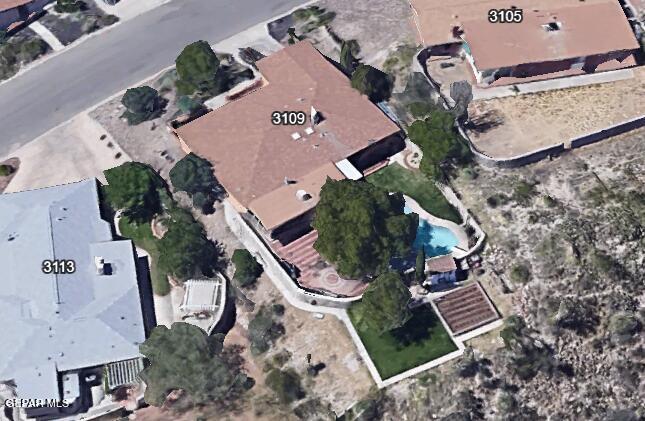 view of property location with a pool