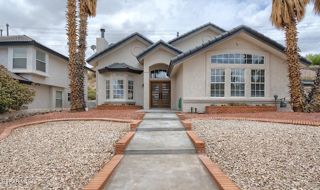 7413 Le Conte Dr, El Paso, TX 79912 - view of front of house featuring french doors and stucco siding