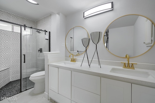 7413 Le Conte Dr, El Paso, TX 79912 - bathroom with a shower stall, double vanity, and toilet