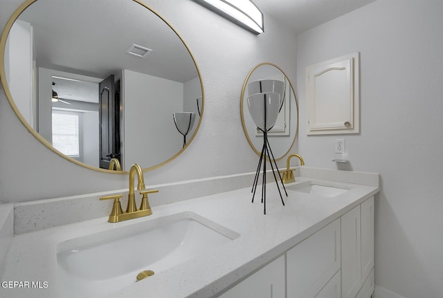 7413 Le Conte Dr, El Paso, TX 79912 - full bath with double vanity and a ceiling fan