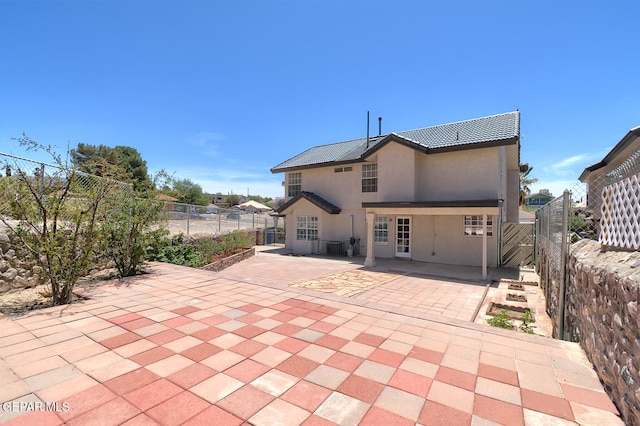 7413 Le Conte Dr, El Paso, TX 79912 - rear view of house with a patio area, fence, and stucco siding
