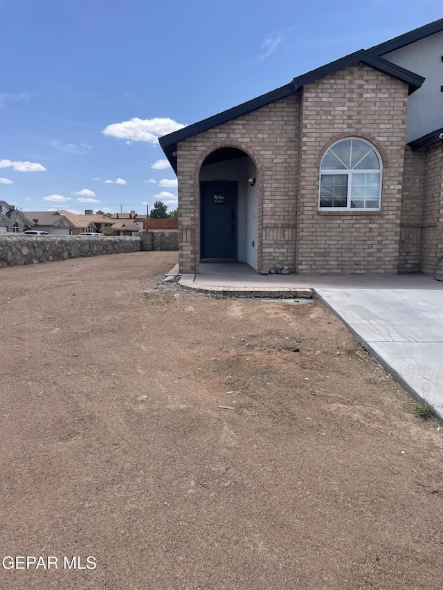 472 Valle Suave Dr, Socorro, TX 79927 - entrance to property featuring brick siding