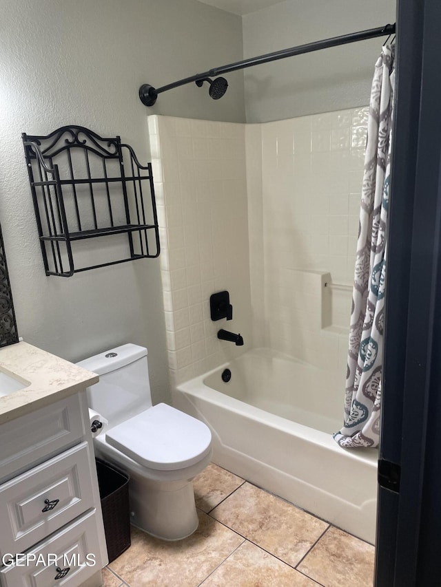 472 Valle Suave Dr, Socorro, TX 79927 - bathroom featuring shower / bath combo, tile patterned flooring, toilet, vanity, and a textured wall