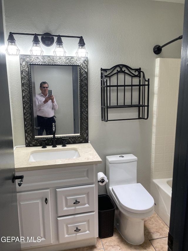 472 Valle Suave Dr, Socorro, TX 79927 - full bathroom with tile patterned flooring, toilet, vanity, and bathtub / shower combination