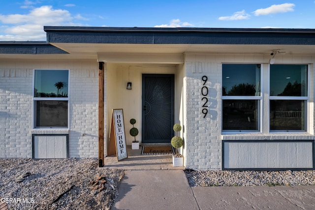 9029 Geranium Dr, El Paso, TX 79907 - doorway to property featuring brick siding