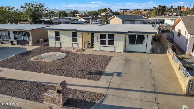 9029 Geranium Dr, El Paso, TX 79907 - view of front of home with a residential view, fence, and brick siding
