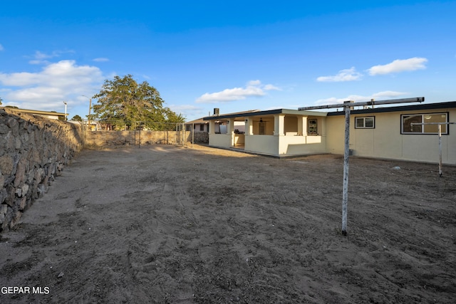 9029 Geranium Dr, El Paso, TX 79907 - back of house with a fenced backyard