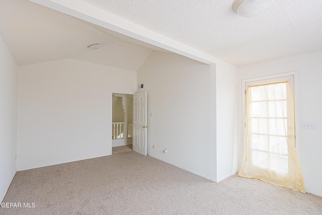 3020 Lake Travis Pl, El Paso, TX 79936 - carpeted spare room featuring a textured ceiling and lofted ceiling