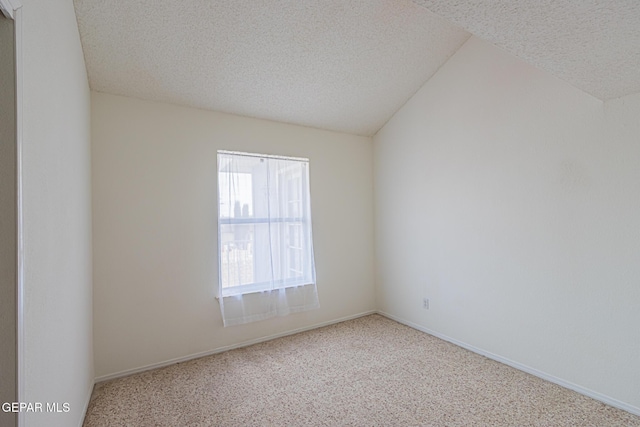 3020 Lake Travis Pl, El Paso, TX 79936 - carpeted empty room featuring a textured ceiling, baseboards, and vaulted ceiling