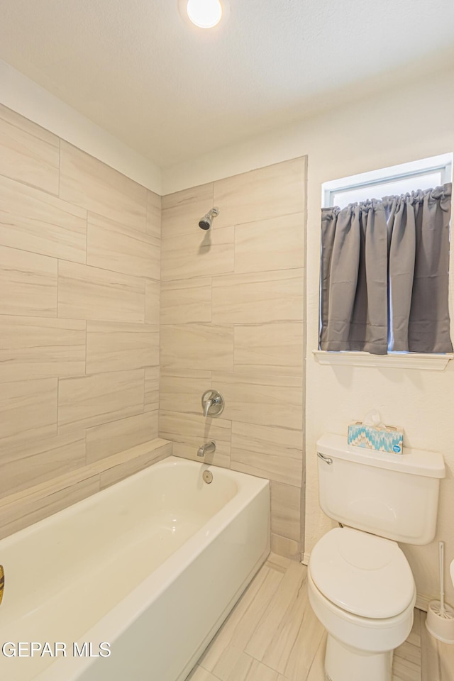 3020 Lake Travis Pl, El Paso, TX 79936 - bathroom with toilet, bathing tub / shower combination, and tile patterned floors