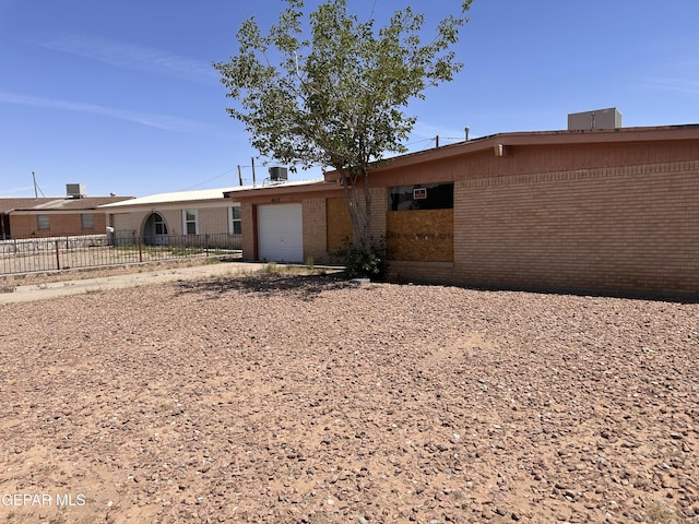 10612 Elsa Pl, El Paso, TX 79924 - view of front of property featuring brick siding, an attached garage, driveway, and fence