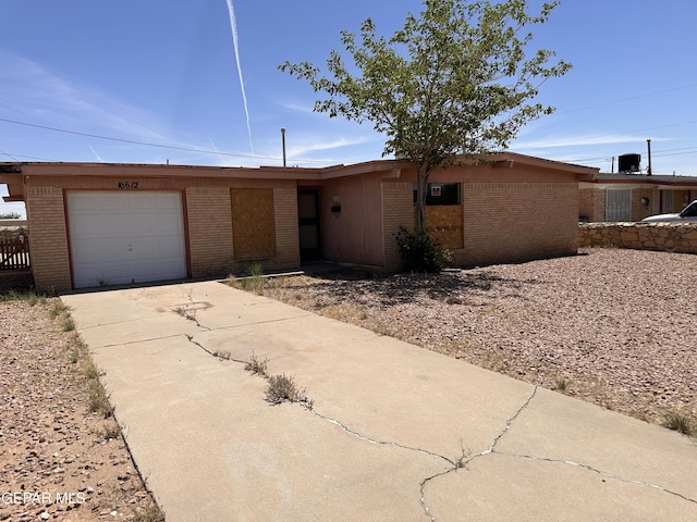 10612 Elsa Pl, El Paso, TX 79924 - single story home featuring brick siding, driveway, and a garage