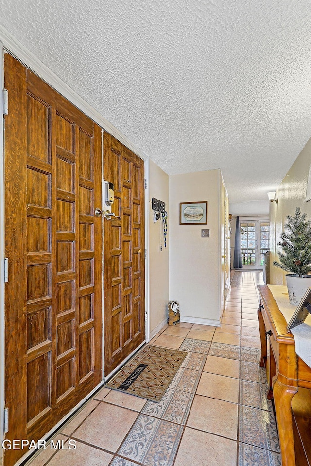 1664 Lou Graham Dr, El Paso, TX 79936 - foyer featuring a textured ceiling and baseboards