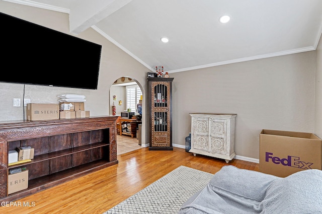 1664 Lou Graham Dr, El Paso, TX 79936 - living room featuring arched walkways, wood finished floors, ornamental molding, baseboards, and recessed lighting