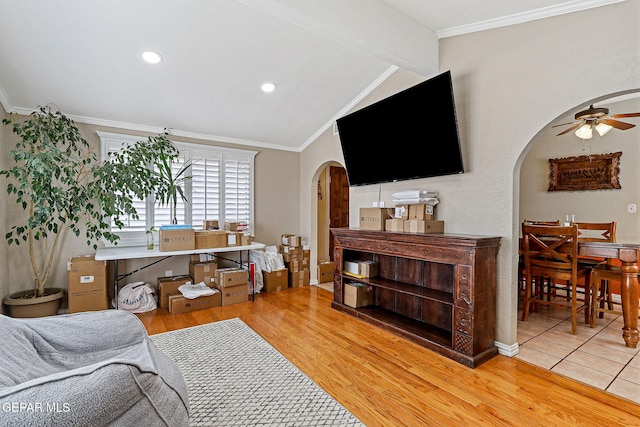 1664 Lou Graham Dr, El Paso, TX 79936 - living room featuring arched walkways, a ceiling fan, wood finished floors, crown molding, and recessed lighting