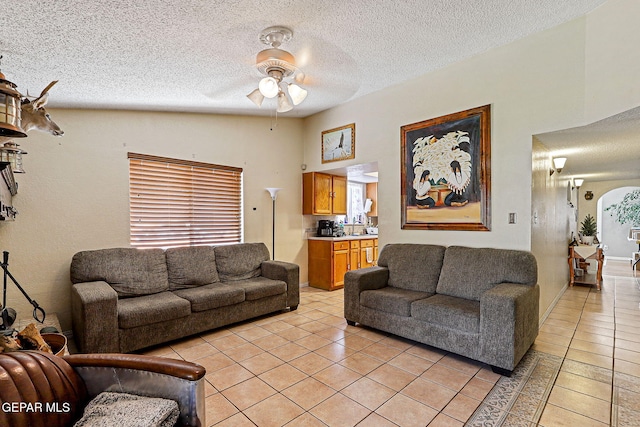 1664 Lou Graham Dr, El Paso, TX 79936 - living room featuring light tile patterned flooring, ceiling fan, and a textured ceiling