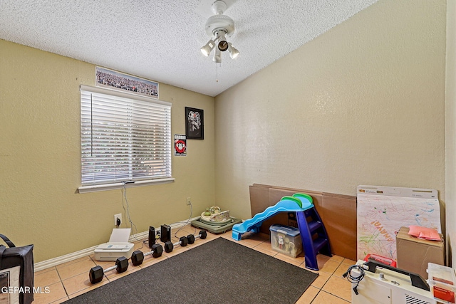 1664 Lou Graham Dr, El Paso, TX 79936 - miscellaneous room featuring tile patterned floors, a textured ceiling, a textured wall, and ceiling fan