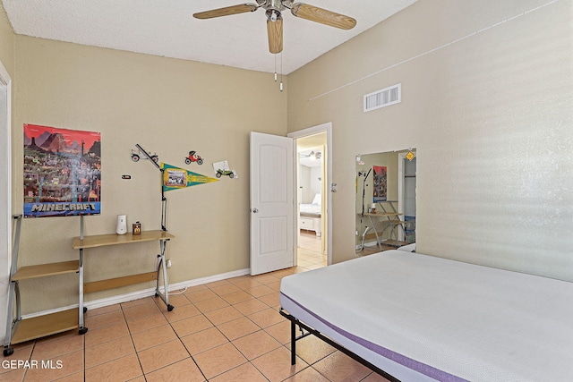 1664 Lou Graham Dr, El Paso, TX 79936 - bedroom with light tile patterned floors, a high ceiling, and baseboards