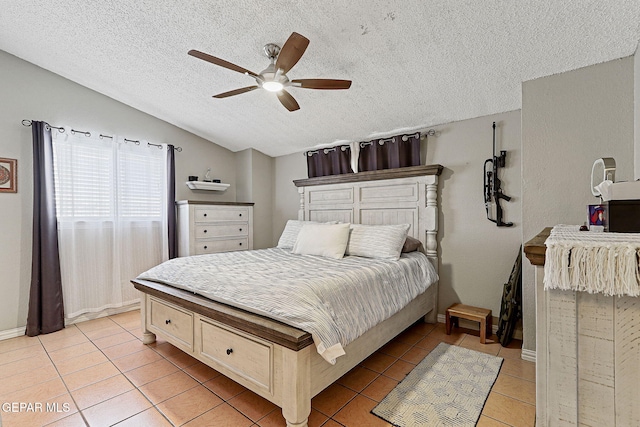 1664 Lou Graham Dr, El Paso, TX 79936 - bedroom with light tile patterned flooring, a textured ceiling, vaulted ceiling, and a ceiling fan