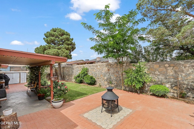 1664 Lou Graham Dr, El Paso, TX 79936 - view of patio / terrace with a shed, a fire pit, an outdoor structure, and a fenced backyard