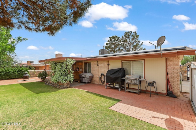 1664 Lou Graham Dr, El Paso, TX 79936 - back of house featuring a patio area, solar panels, and a yard