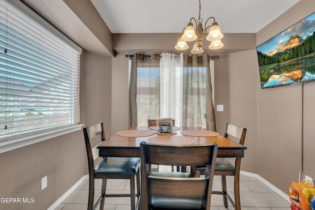 11129 Catherine Slutter Ln, Socorro, TX 79927 - dining room featuring a chandelier, light tile patterned floors, and baseboards