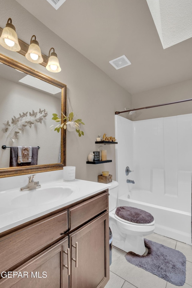 11129 Catherine Slutter Ln, Socorro, TX 79927 - bathroom with tile patterned flooring, toilet, vanity, and washtub / shower combination