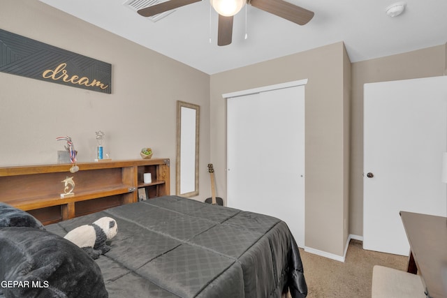 11129 Catherine Slutter Ln, Socorro, TX 79927 - carpeted bedroom featuring a closet, baseboards, and ceiling fan
