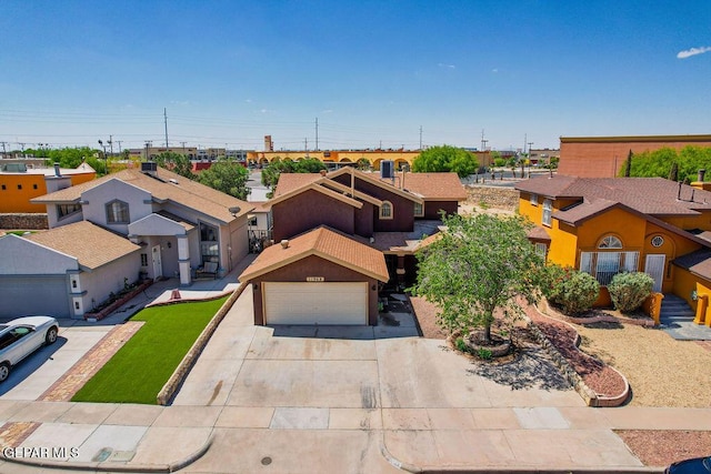 11968 Frances Scobee Dr, El Paso, TX 79936 - view of front facade with a residential view, concrete driveway, and an attached garage
