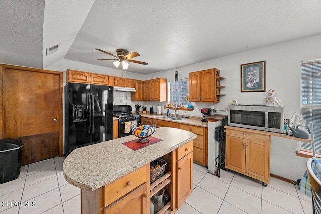 11968 Frances Scobee Dr, El Paso, TX 79936 - kitchen featuring black appliances, under cabinet range hood, a textured ceiling, a sink, and ceiling fan