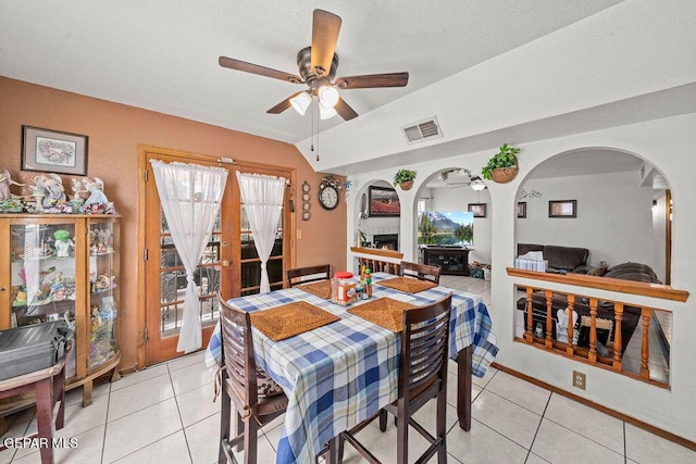 11968 Frances Scobee Dr, El Paso, TX 79936 - dining room with arched walkways, ceiling fan, light tile patterned floors, and lofted ceiling
