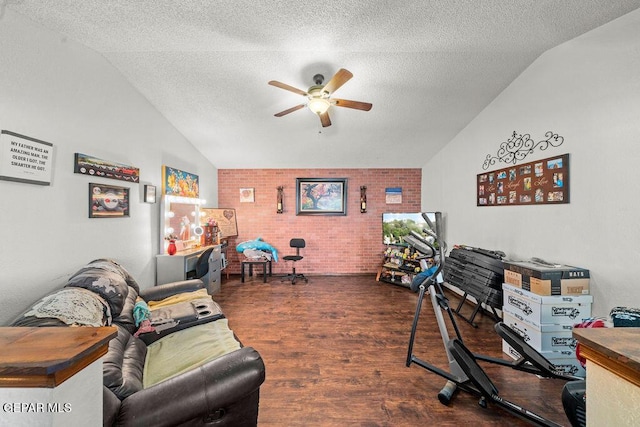 11968 Frances Scobee Dr, El Paso, TX 79936 - office space with vaulted ceiling, a ceiling fan, brick wall, wood finished floors, and a textured ceiling