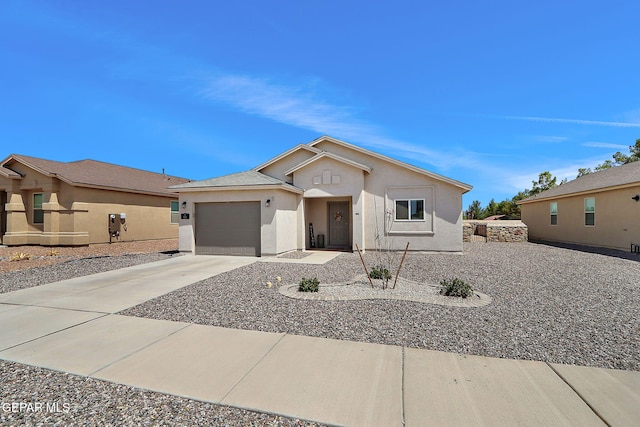 436 Sun Temple Rd, Socorro, TX 79927 - ranch-style home featuring concrete driveway, stucco siding, and an attached garage