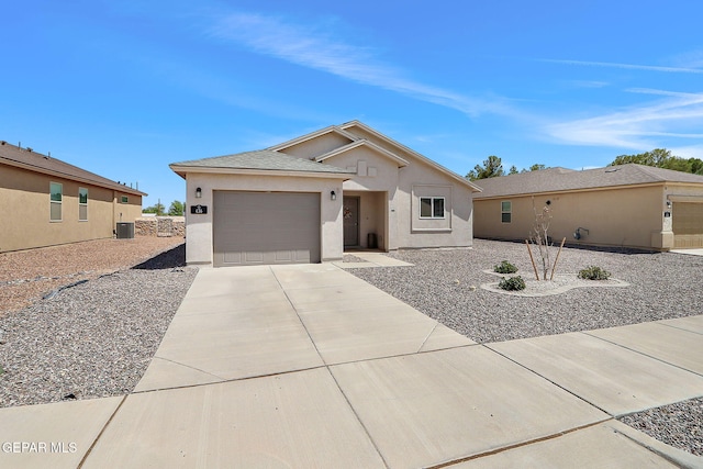 436 Sun Temple Rd, Socorro, TX 79927 - single story home with stucco siding, concrete driveway, and a garage