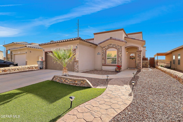 2005 Roy Vinson, El Paso, TX 79938 - mediterranean / spanish-style home featuring stucco siding, a garage, concrete driveway, fence, and stone siding