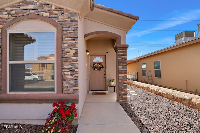 2005 Roy Vinson, El Paso, TX 79938 - doorway to property featuring stone siding and stucco siding