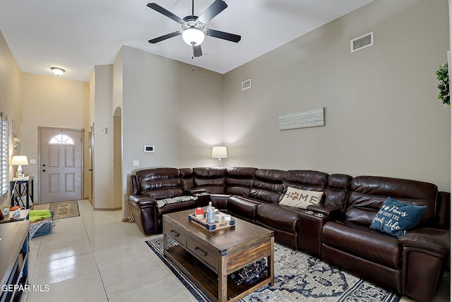 2005 Roy Vinson, El Paso, TX 79938 - living area featuring arched walkways, ceiling fan, light tile patterned floors, and a towering ceiling