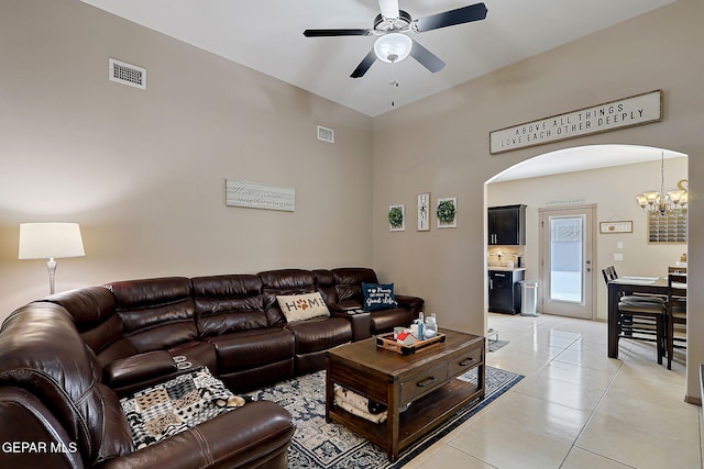 2005 Roy Vinson, El Paso, TX 79938 - living room with arched walkways, ceiling fan, light tile patterned flooring, and a chandelier