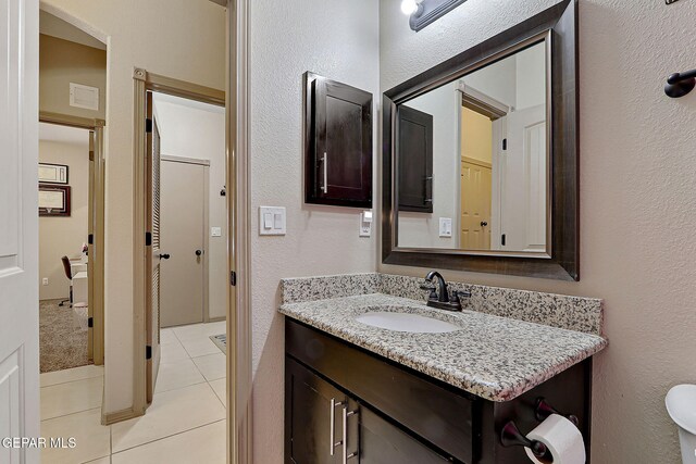 2005 Roy Vinson, El Paso, TX 79938 - bathroom featuring tile patterned flooring, vanity, and a textured wall