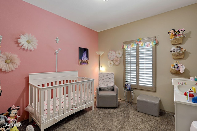 2005 Roy Vinson, El Paso, TX 79938 - bedroom featuring a crib, carpet flooring, and baseboards