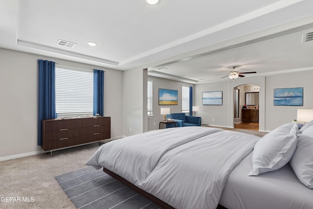 2808 Tierra De Moyo Pl, El Paso, TX 79938 - bedroom featuring arched walkways, baseboards, a raised ceiling, light carpet, and recessed lighting
