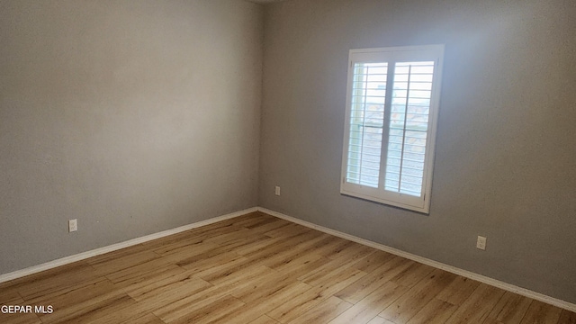 12869 Woolstone Dr, El Paso, TX 79928 - empty room with light wood-type flooring, healthy amount of natural light, and baseboards