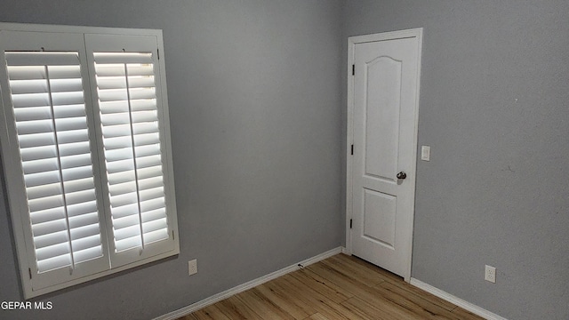12869 Woolstone Dr, El Paso, TX 79928 - spare room featuring light wood-style floors and baseboards