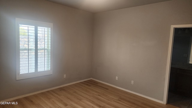 12869 Woolstone Dr, El Paso, TX 79928 - spare room with light wood-style flooring and baseboards