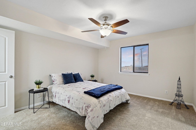 bedroom with carpet flooring, baseboards, and a ceiling fan